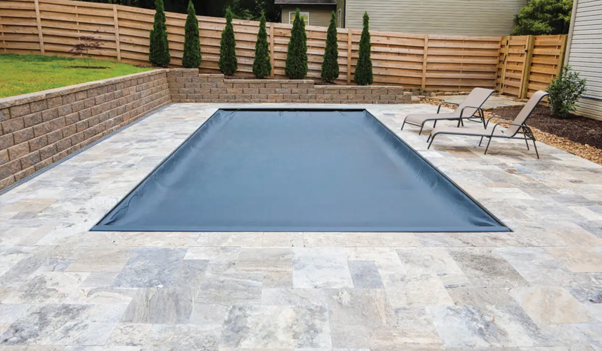 Integra pool cover fabric designed to shed water and prevent dangerous puddles from forming.
